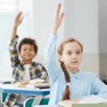 children-raising-hands-in-school.jpg